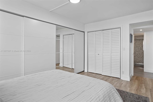 bedroom with hardwood / wood-style flooring