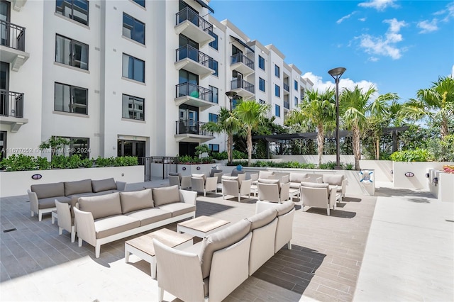 view of patio / terrace featuring an outdoor living space and a balcony