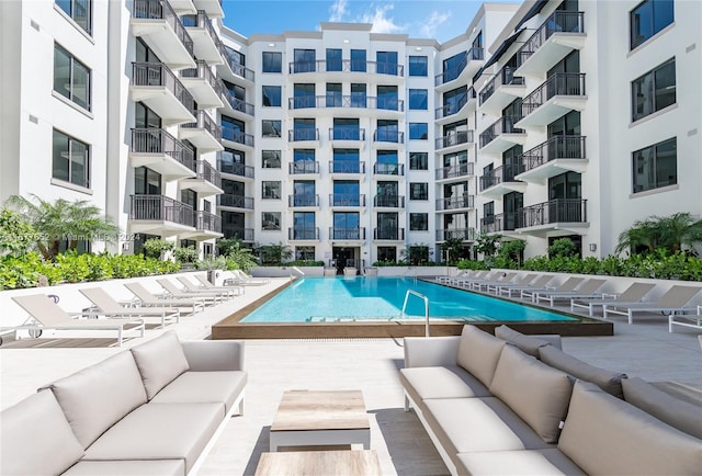 view of pool with outdoor lounge area and a patio area