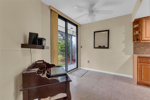 doorway to outside featuring ceiling fan and light tile patterned flooring