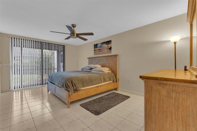 bedroom featuring ceiling fan, light tile patterned floors, and access to outside