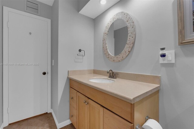 bathroom with vanity and tile patterned floors