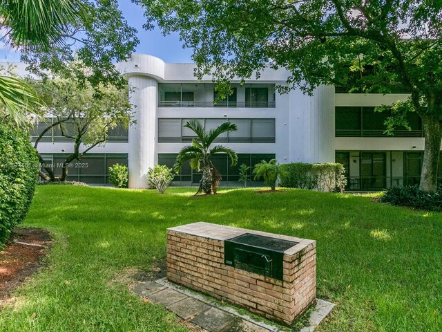 view of community featuring a lawn