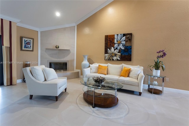 living room featuring a fireplace, vaulted ceiling, and ornamental molding