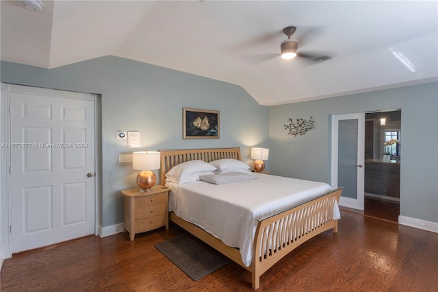 bedroom with dark hardwood / wood-style flooring, ceiling fan, and lofted ceiling