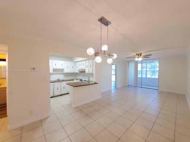 kitchen featuring kitchen peninsula, sink, light tile patterned flooring, white range with electric cooktop, and white cabinetry