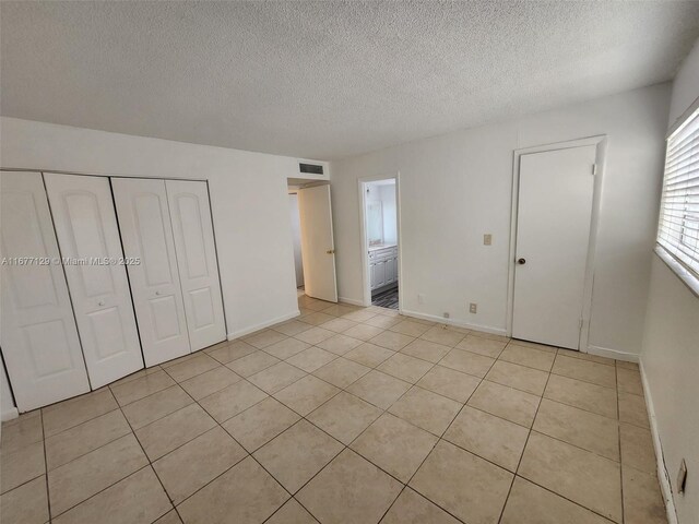 bathroom featuring vanity, toilet, and tile patterned flooring