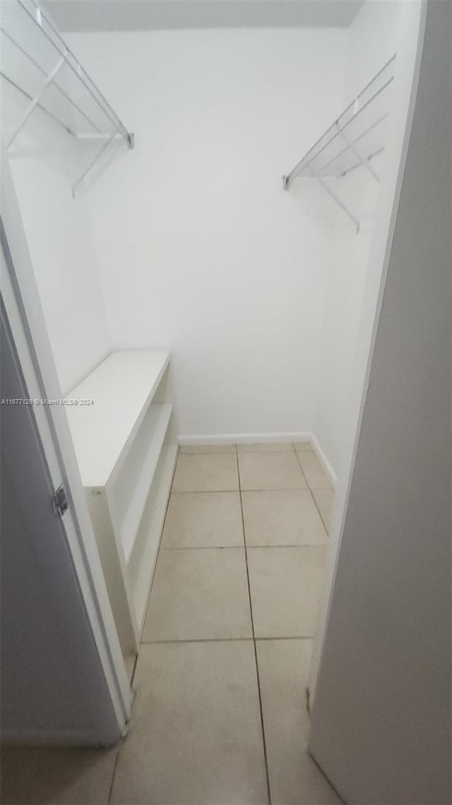 walk in closet featuring light tile patterned floors