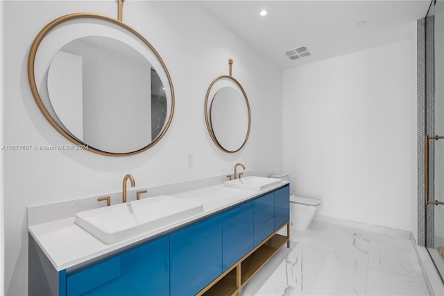 bathroom featuring toilet and vanity