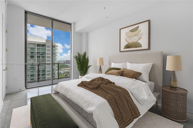 bedroom with access to outside and expansive windows