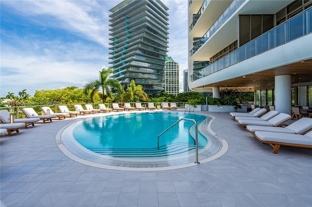 view of swimming pool with a patio