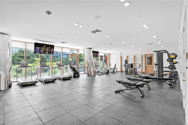 exercise room featuring floor to ceiling windows