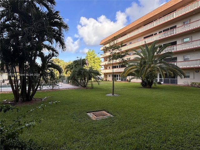 view of community featuring a lawn