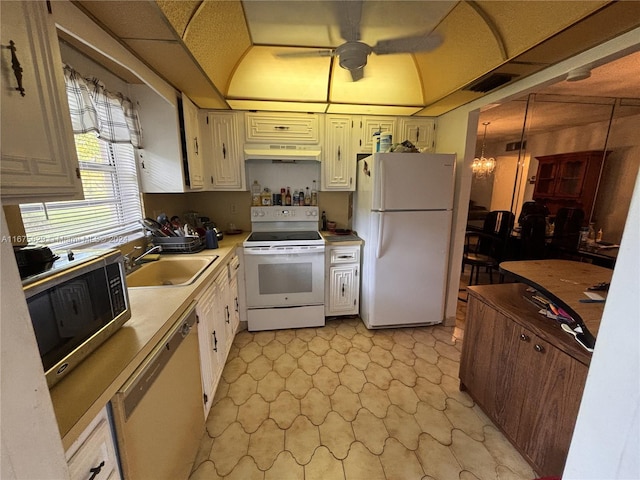 5300 Washington St Unit U103, Hollywood, FL 33021 - kitchen featuring a sink, under cabinet range hood, white appliances, light countertops, and light floors