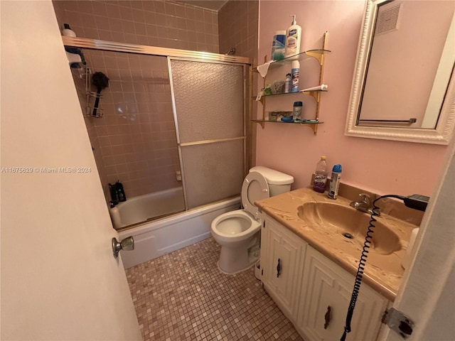 5300 Washington St Unit U103, Hollywood, FL 33021 - full bathroom featuring tile patterned floors, vanity, toilet, and enclosed tub / shower combo