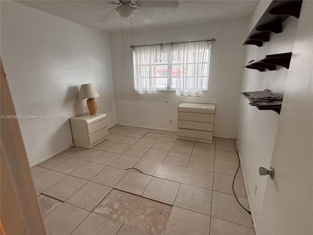 5300 Washington St Unit U103, Hollywood, FL 33021 - spare room featuring light tile patterned floors, a ceiling fan, and a textured ceiling