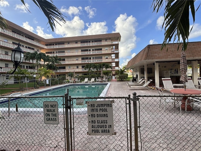 view of swimming pool with a patio