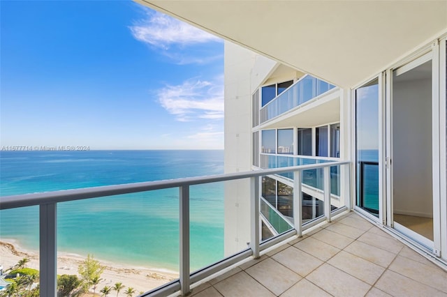 balcony with a view of the beach and a water view