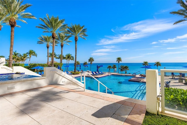 view of pool with a water view