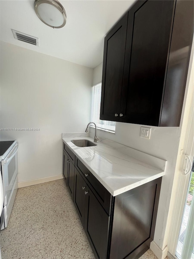 kitchen with white range oven and sink