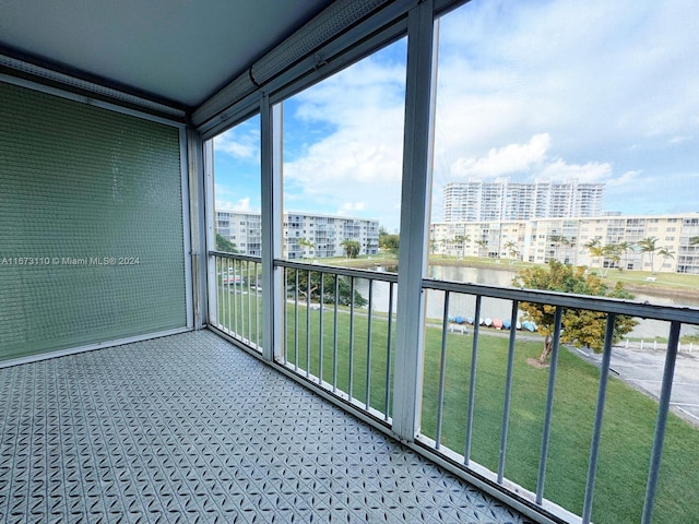 balcony featuring a water view