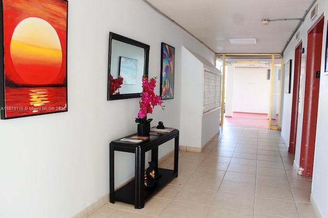 corridor with light tile patterned floors