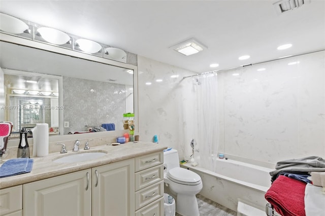 full bathroom with vanity, shower / bath combination with curtain, and toilet