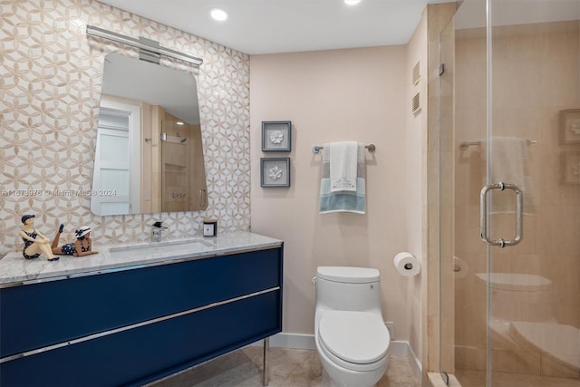 bathroom with a shower stall, decorative backsplash, vanity, baseboards, and toilet