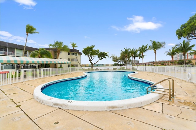 view of pool featuring a patio area