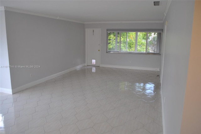 unfurnished room featuring crown molding