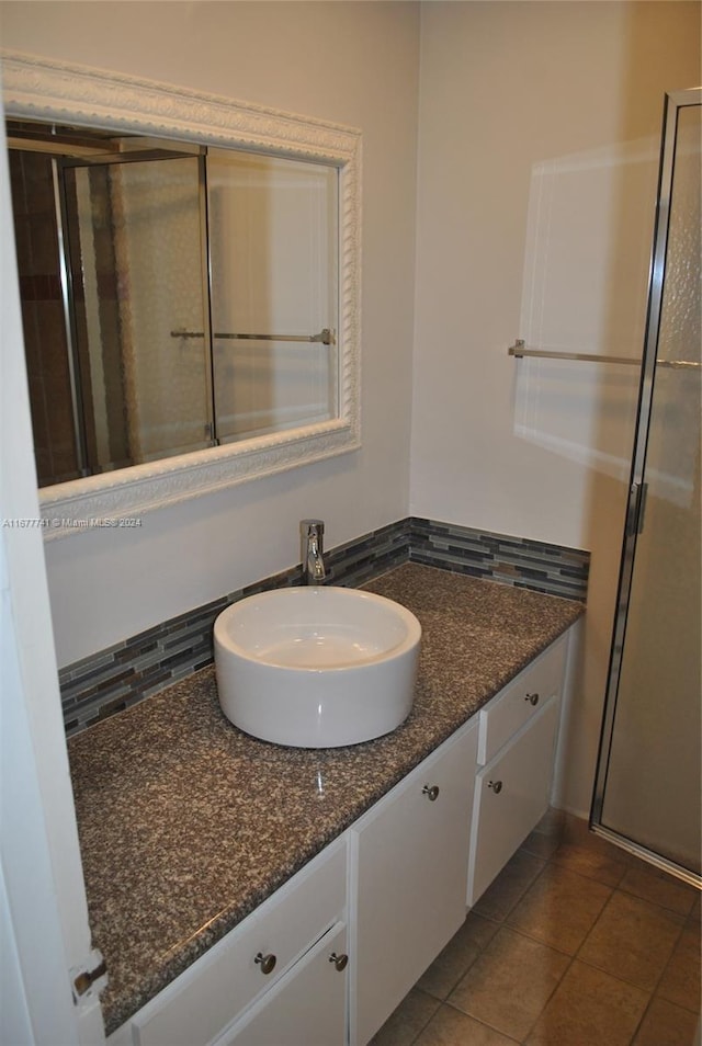 bathroom featuring tile patterned floors and vanity