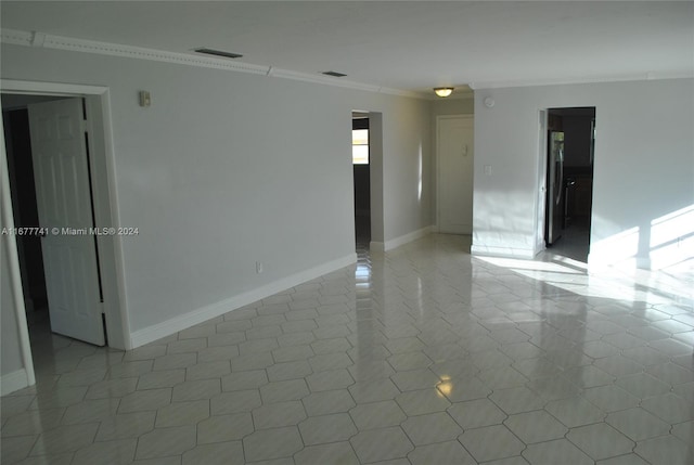 tiled empty room with ornamental molding