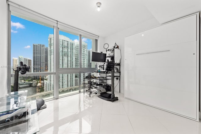 interior space with light tile patterned floors and floor to ceiling windows