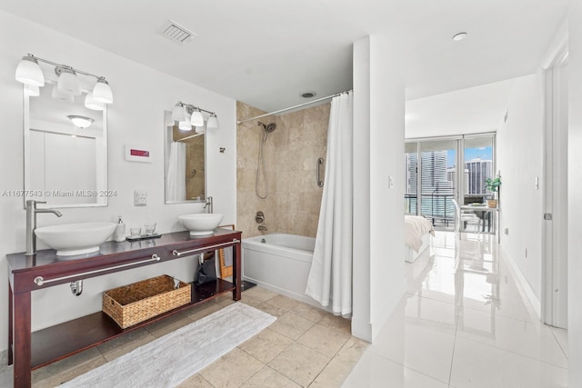 bathroom with vanity, shower / tub combo, and tile patterned flooring