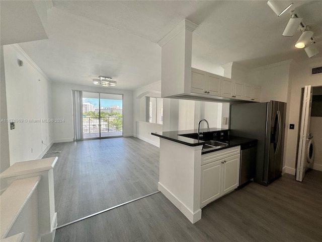 kitchen with white cabinetry, stainless steel appliances, sink, and dark hardwood / wood-style floors