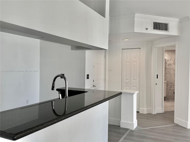 kitchen with hardwood / wood-style flooring