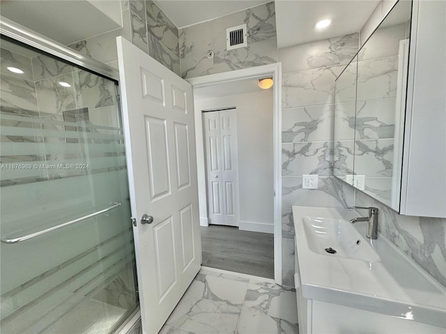 bathroom with vanity and walk in shower