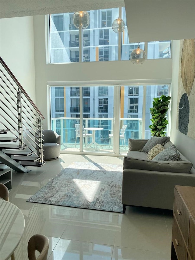 tiled living room with a high ceiling