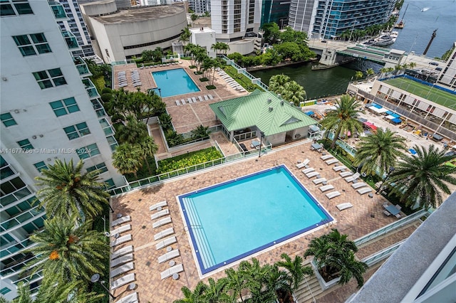 birds eye view of property with a water view