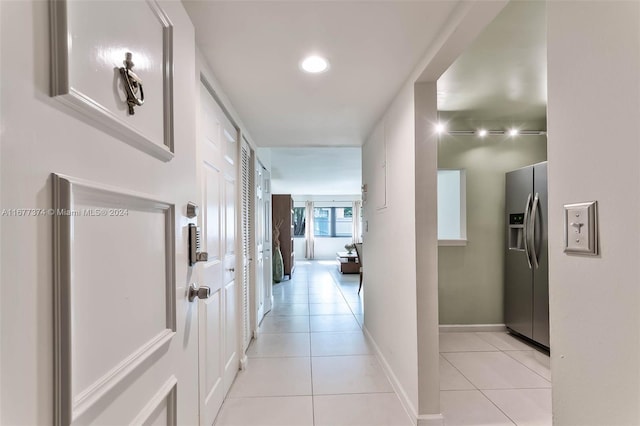 hallway with light tile patterned floors