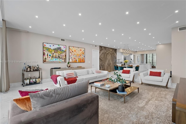 living room featuring a notable chandelier