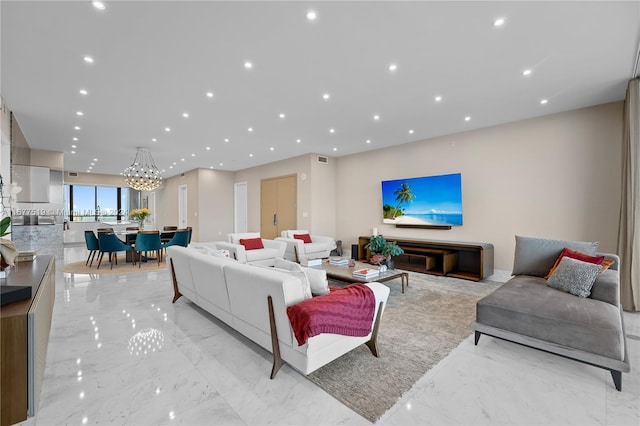 living room featuring an inviting chandelier