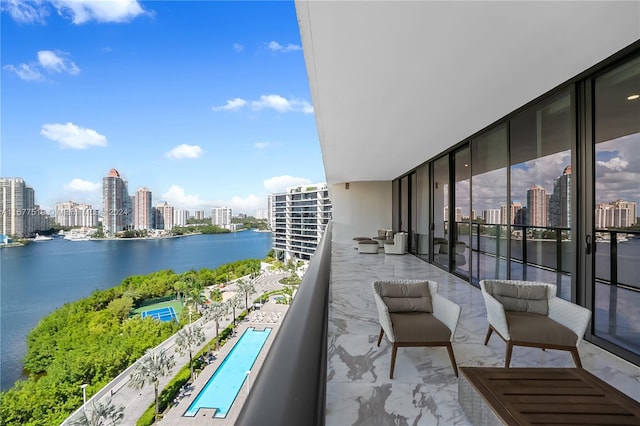 balcony featuring a water view