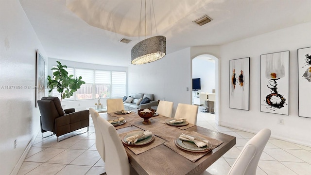 dining area with light tile patterned flooring