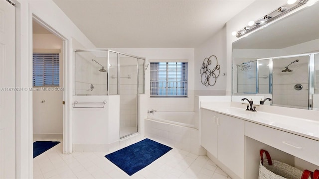 bathroom featuring vanity, tile patterned floors, and plus walk in shower