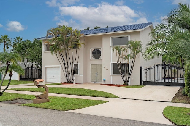 mediterranean / spanish-style home featuring a garage