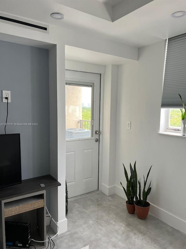 doorway to outside featuring a wealth of natural light