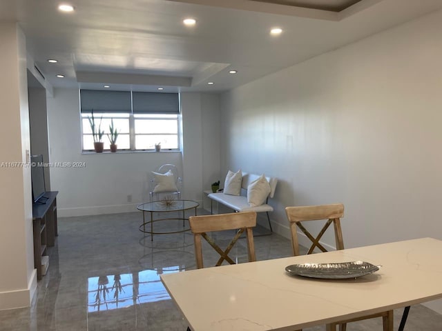 dining area with a tray ceiling