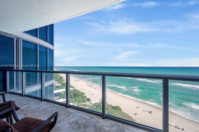 balcony with a view of the beach and a water view