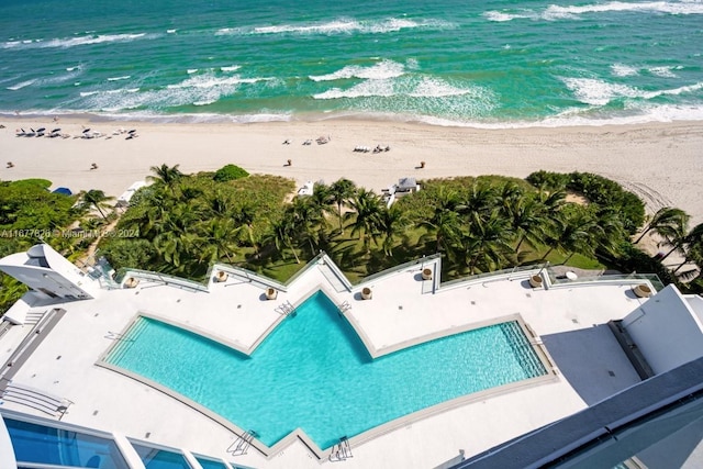 aerial view featuring a view of the beach and a water view